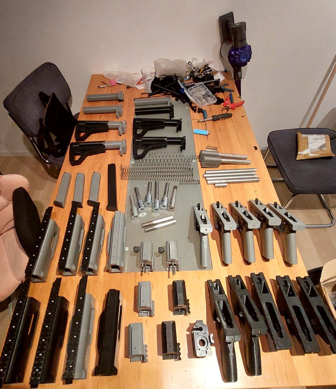 Gunsmith performing professional gun cleaning and firearm maintenance